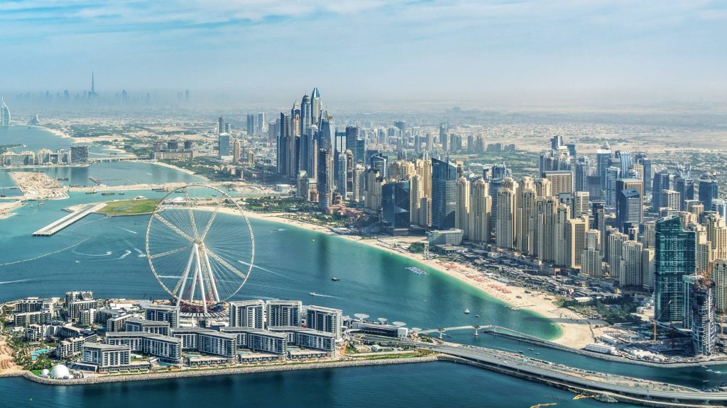 Panoramic aerial view of Dubai Marina skyline with Dubai Eye ferris wheel, United Arab Emirates
