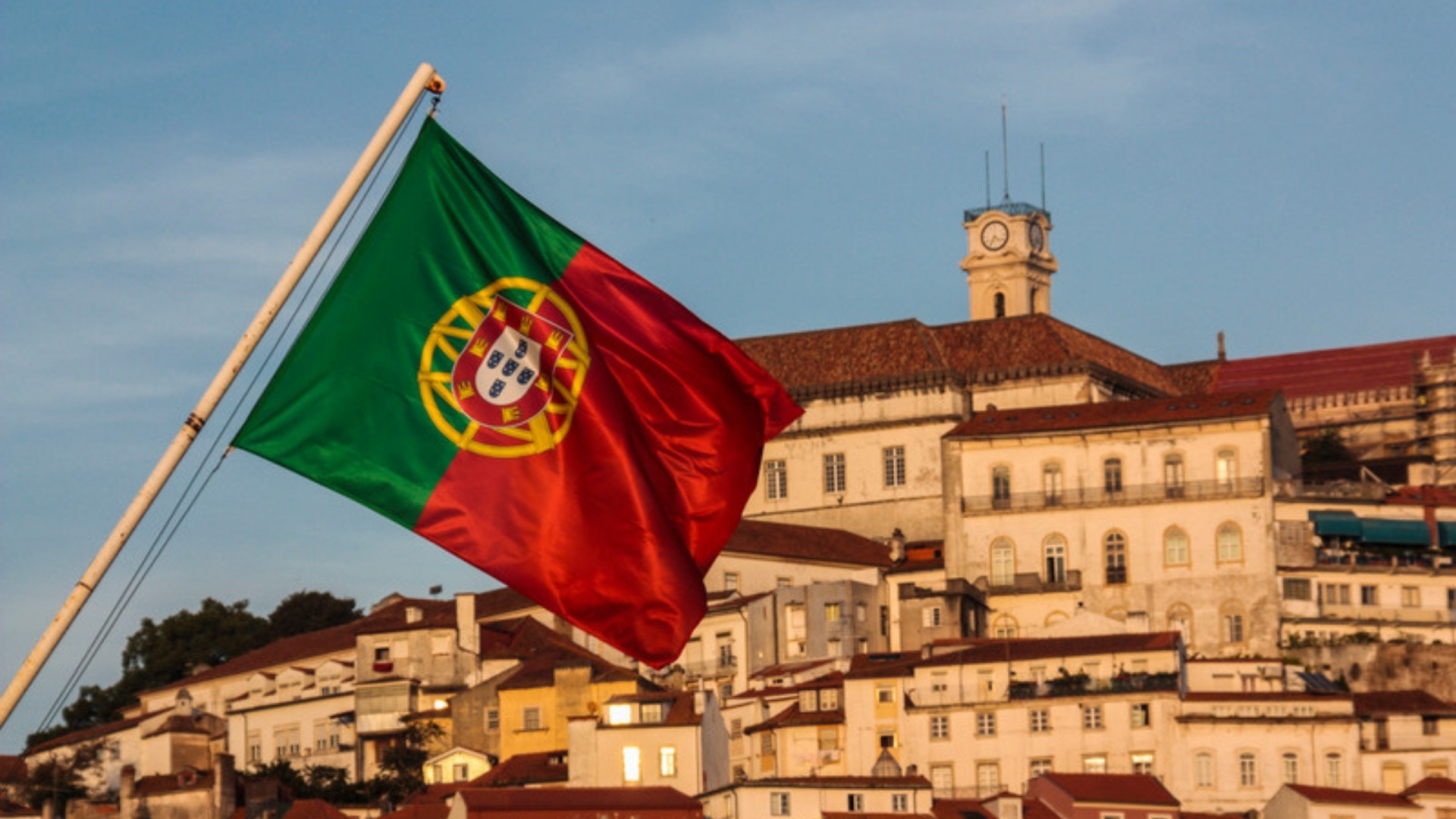 Portuguese flag flying over Coimbra, Portuguese nationality and residence permits
